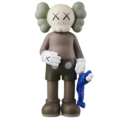 KAWS Figura Coleccionable sosteniendo un muñeco